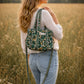 Handmade Cotton Mini Tote Bag - Lila - Wild Meadow - Olive hanging on a wooden hook with a stylish design.