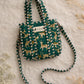Handmade Cotton Mini Tote Bag - Lila - Wild Meadow - Olive hanging on a wooden hook with a stylish design.