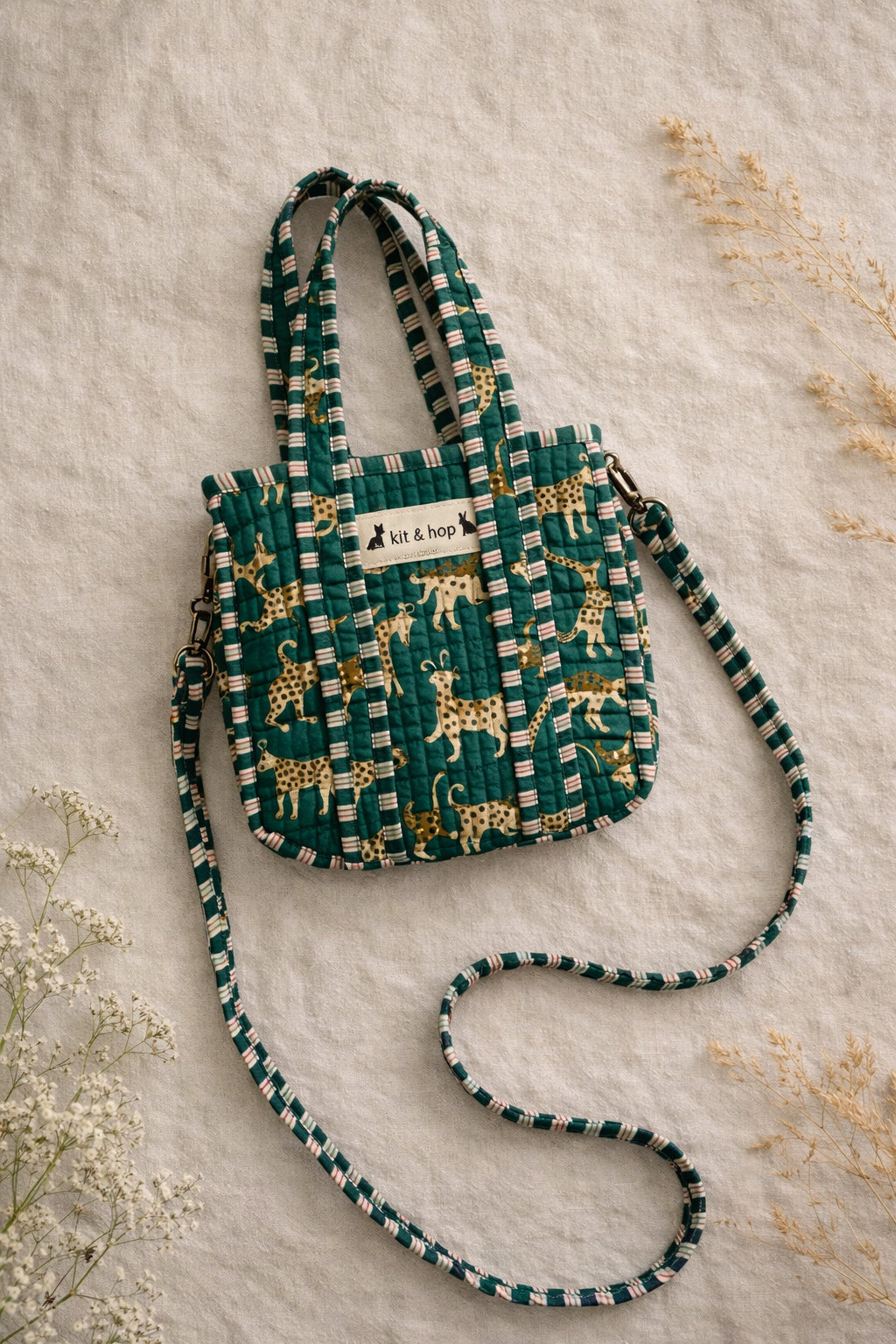 Handmade Cotton Mini Tote Bag - Lila - Wild Meadow - Olive hanging on a wooden hook with a stylish design.