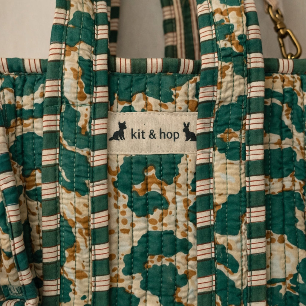 Handmade Cotton Mini Tote Bag - Lila - Wild Meadow - Olive hanging on a wooden hook with a stylish design.