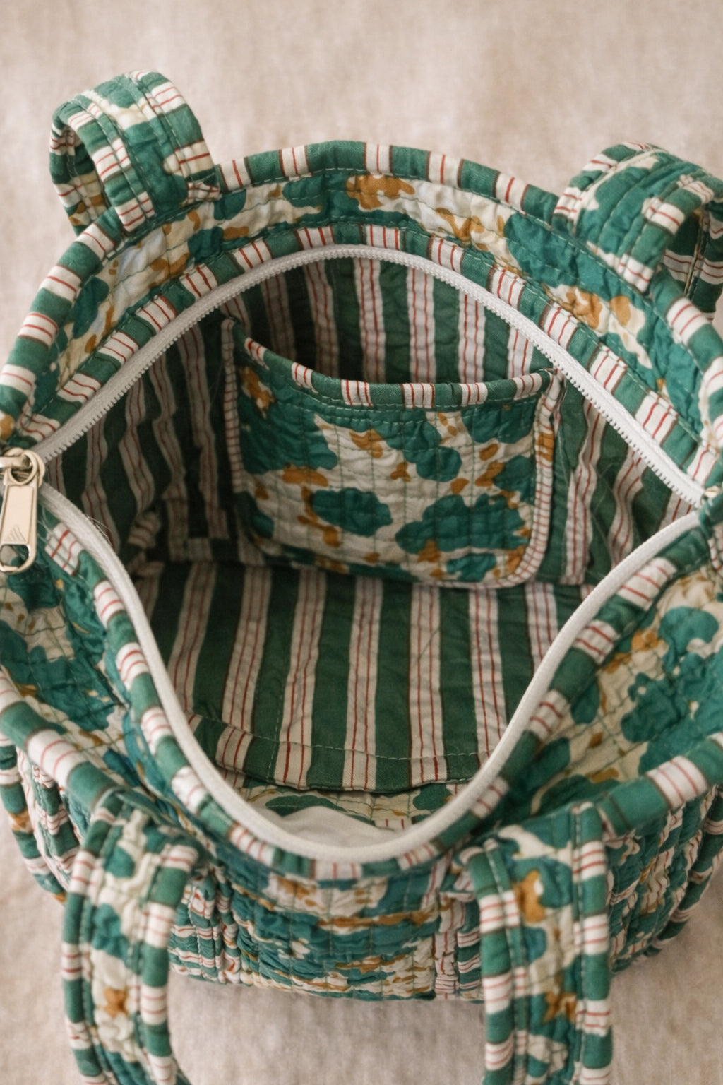 Handmade Cotton Mini Tote Bag - Lila - Wild Meadow - Olive hanging on a wooden hook with a stylish design.