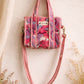 Handmade Cotton Mini Tote Bag - Lila - Wild Meadow - Paloma hanging against a wall with floral decorations.