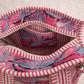 Handmade Cotton Mini Tote Bag - Lila - Wild Meadow - Paloma hanging against a wall with floral decorations.