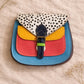 Handmade Leather Crossbody Bag featuring vibrant colors and polka dot design, perfect for stylish everyday use.