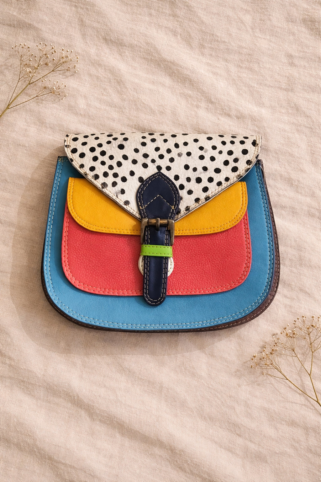 Handmade Leather Crossbody Bag featuring vibrant colors and polka dot design, perfect for stylish everyday use.