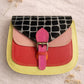 Handmade Leather Crossbody Bag in vibrant colors with unique patterns and a stylish buckle closure.
