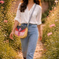 Handmade Leather Crossbody Bag in vibrant colors with unique patterns and a stylish buckle closure.
