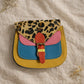 Handmade Leather Crossbody Bag - Romy - Walled Garden - Golden Leopard with colorful panels and leopard print flap.