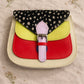 Handmade Leather Crossbody Bag - Romy featuring a multicolor design with polka dots and a stylish buckle.