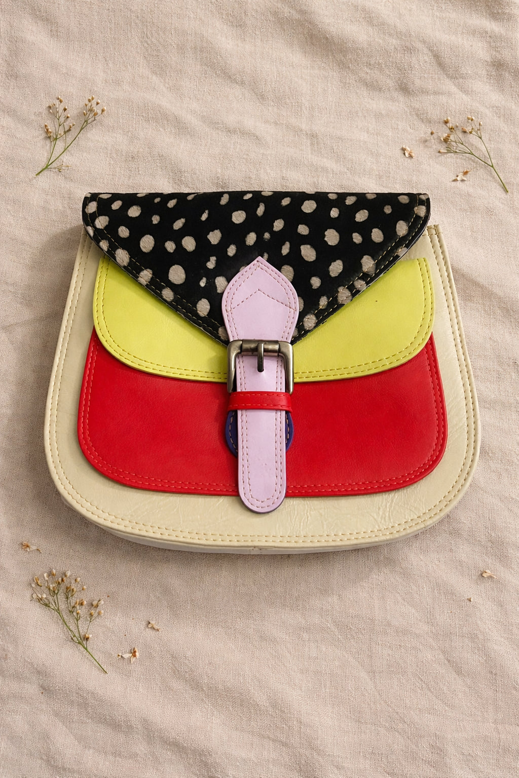 Handmade Leather Crossbody Bag - Romy featuring a multicolor design with polka dots and a stylish buckle.
