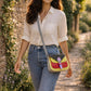Handmade Leather Crossbody Bag - Romy featuring a multicolor design with polka dots and a stylish buckle.