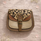 Handmade Leather Crossbody Bag featuring a leopard print flap with brown and green leather accents on a soft background.