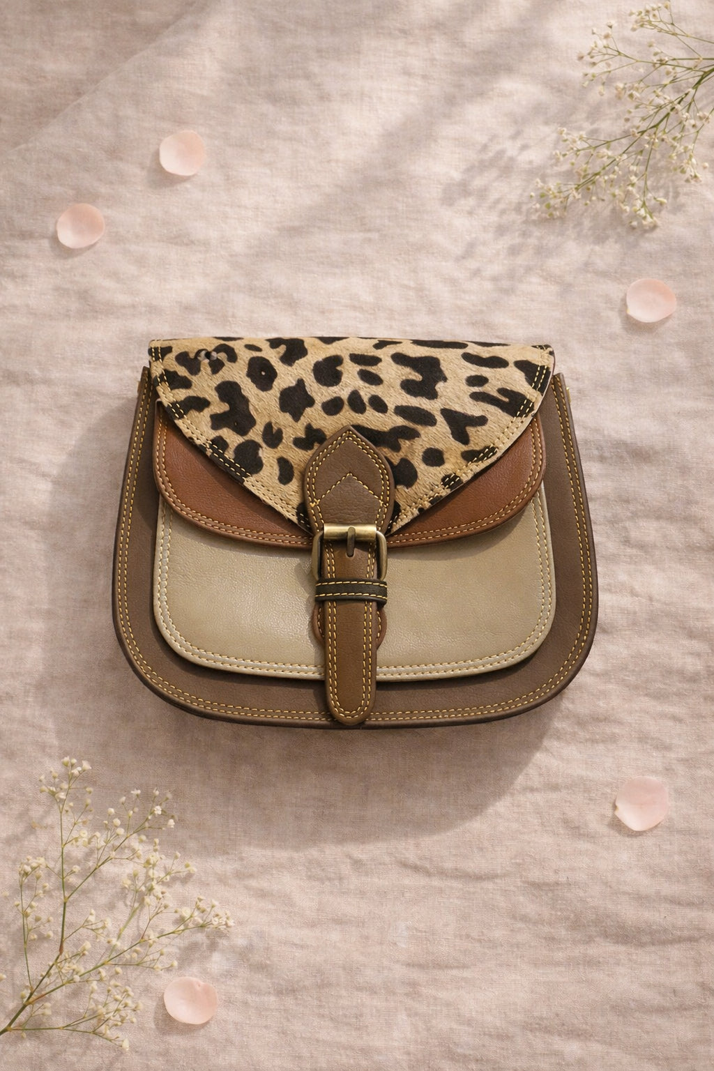 Handmade Leather Crossbody Bag featuring a leopard print flap with brown and green leather accents on a soft background.