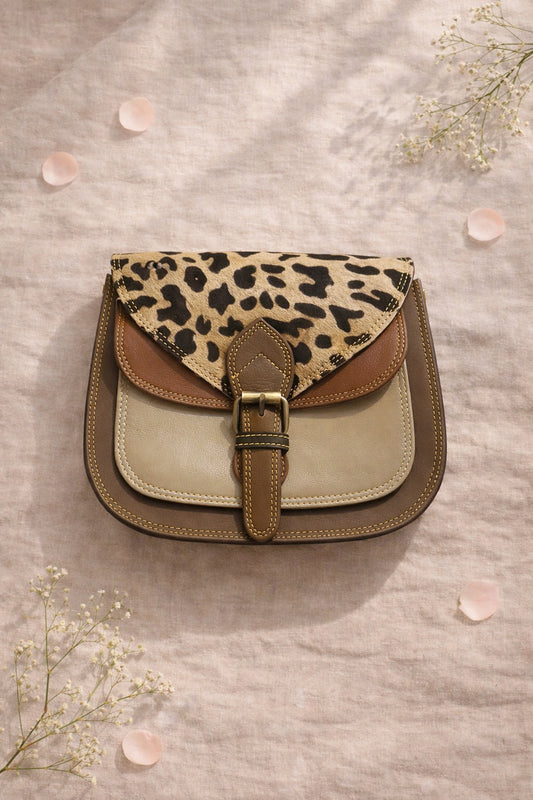 Handmade Leather Crossbody Bag featuring a leopard print flap with brown and green leather accents on a soft background.