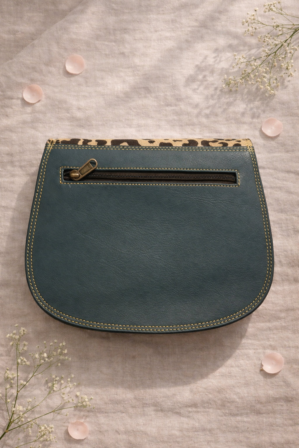 Handmade Leather Crossbody Bag featuring a leopard print flap with brown and green leather accents on a soft background.