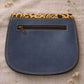 Handmade Leather Crossbody Bag - Romy in vibrant colors with leopard print flap, showcasing unique design and sustainability.