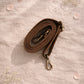 Handmade Leather Crossbody Bag in bright colors with a leopard print flap, displayed on a soft background.