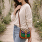 Handmade Leather Crossbody Bag in bright colors with a leopard print flap, displayed on a soft background.