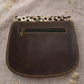 Handmade Leather Crossbody Bag featuring vibrant colors and a unique design with a spotted flap and buckle closure.