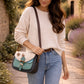 Handmade Leather Crossbody Bag - Romy in Walled Garden Mint with unique patchwork and buckle detail.