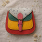 Handmade Leather Crossbody Bag featuring a colorful design in yellow, red, green, and blue shades, ideal for stylish everyday use.