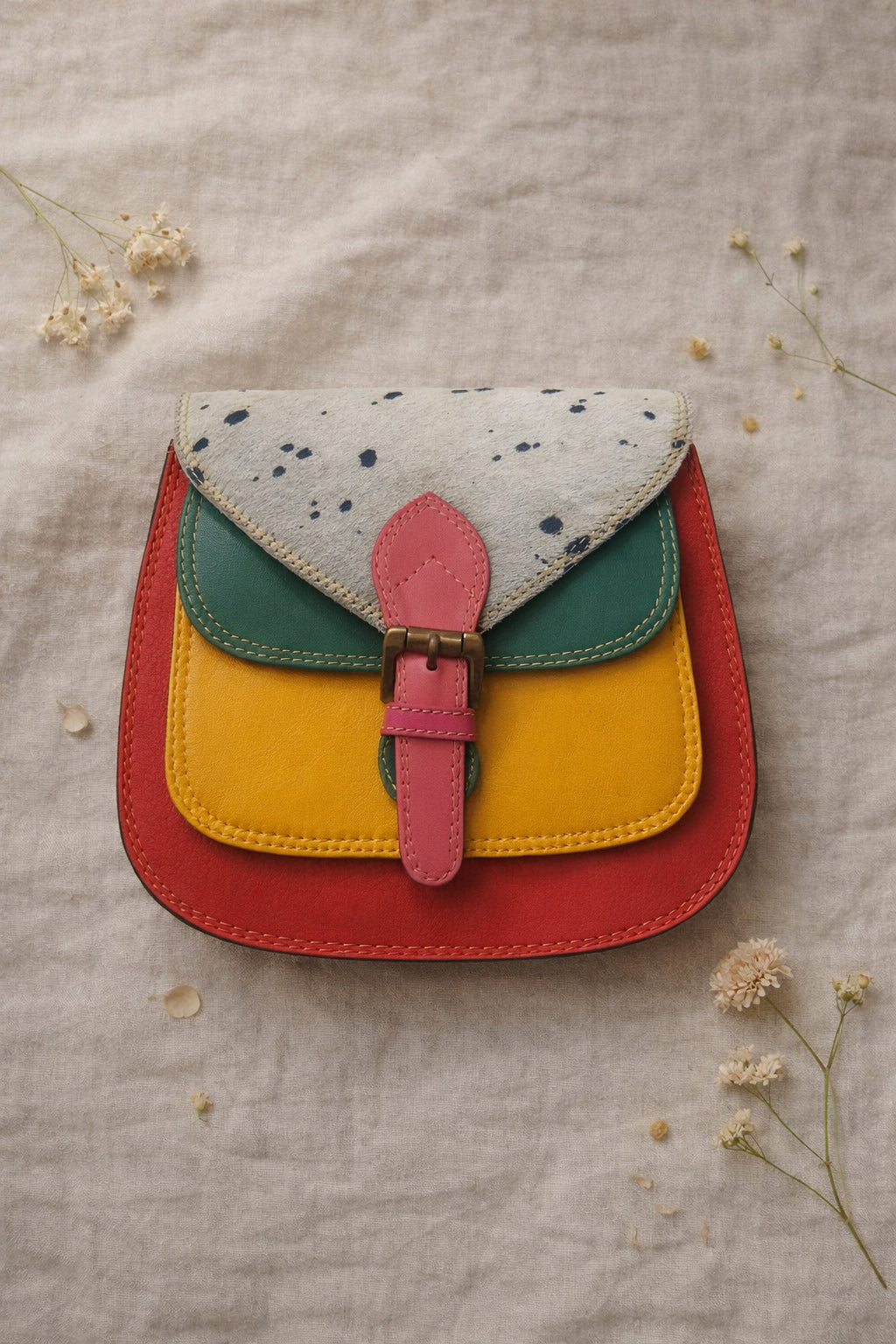Handmade Leather Crossbody Bag featuring a colorful design in yellow, red, green, and blue shades, ideal for stylish everyday use.