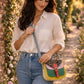 Handmade Leather Crossbody Bag - Romy with colorful panels and animal print flap on a light background.