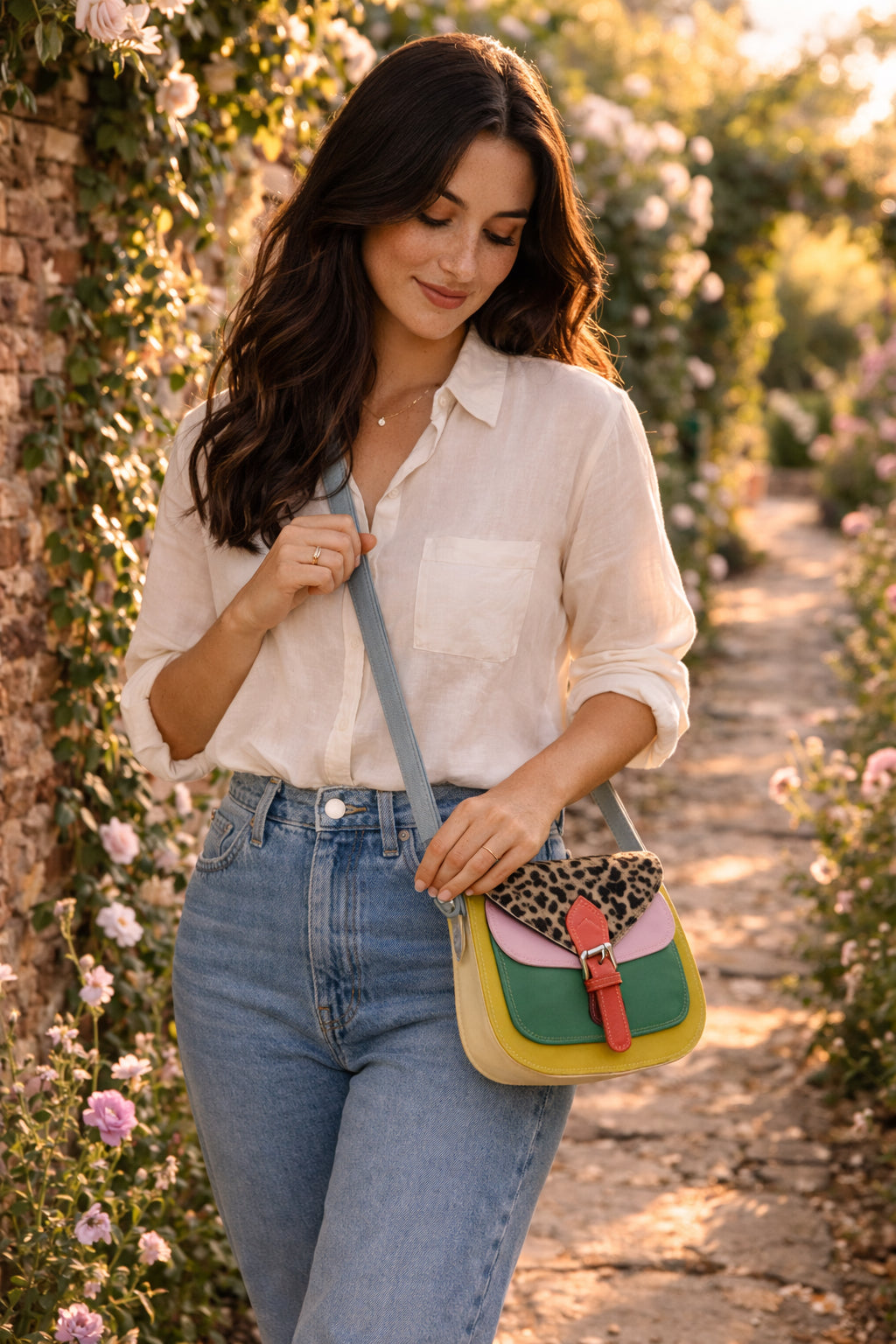 Handmade Leather Crossbody Bag - Romy with colorful panels and animal print flap on a light background.