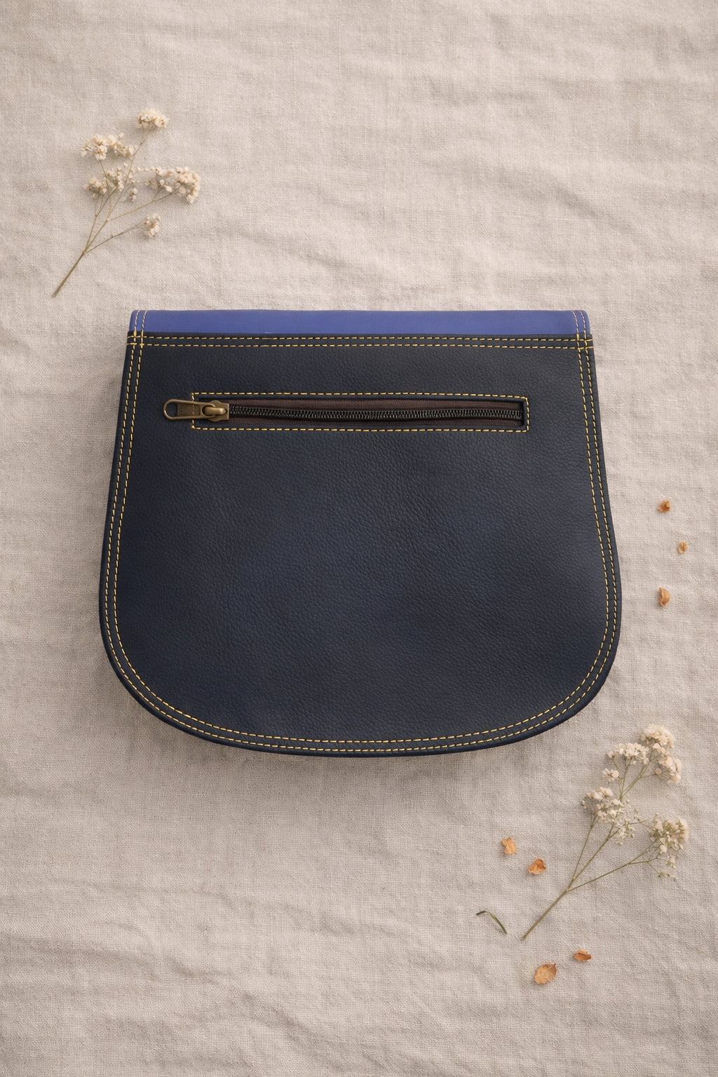 Handmade Leather Crossbody Bag - Romy in walled garden colors, featuring a stylish buckle and floral accents.