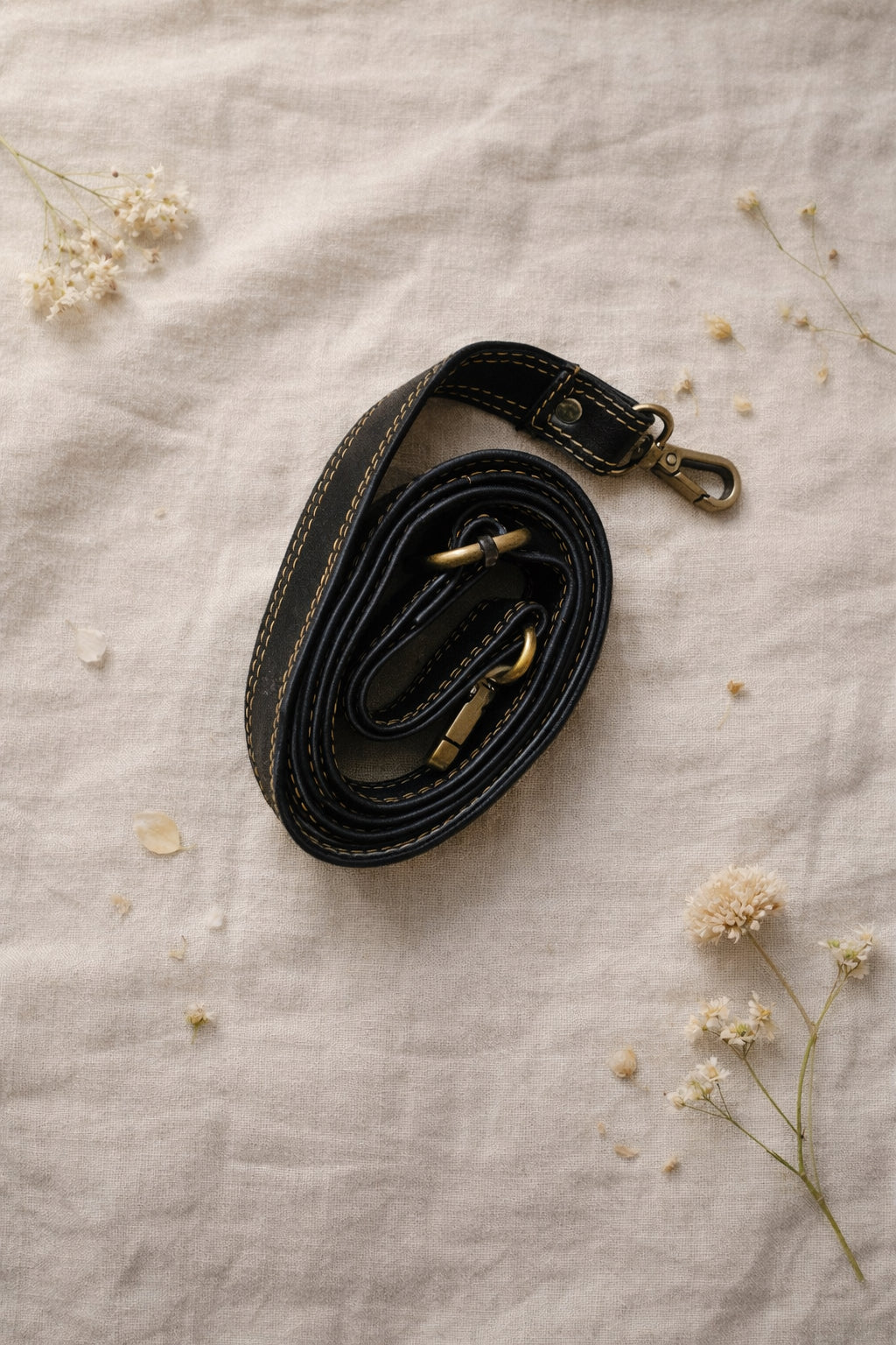 Handmade Leather Crossbody Bag - Romy in walled garden colors, featuring a stylish buckle and floral accents.