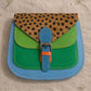 Handmade Leather Crossbody Bag with vibrant colors and polka dot pattern, perfect for everyday style.