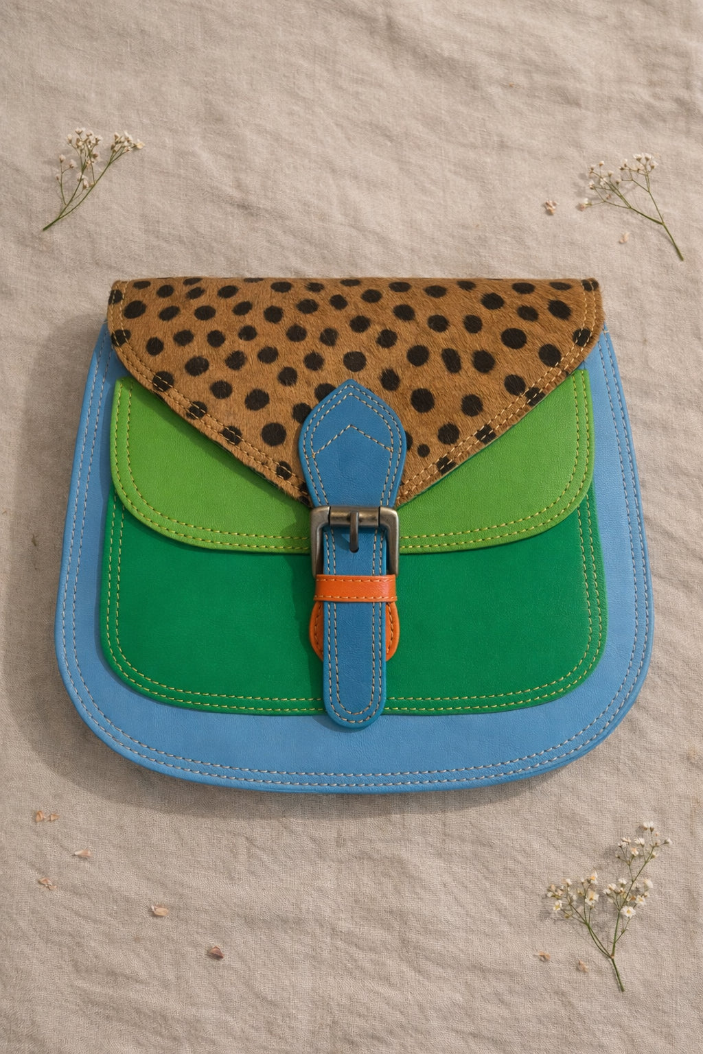 Handmade Leather Crossbody Bag with vibrant colors and polka dot pattern, perfect for everyday style.