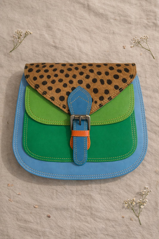 Handmade Leather Crossbody Bag with vibrant colors and polka dot pattern, perfect for everyday style.