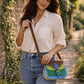 Handmade Leather Crossbody Bag with vibrant colors and polka dot pattern, perfect for everyday style.