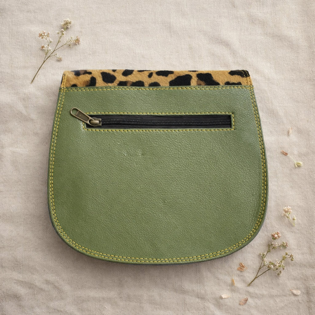 Handmade Leather Crossbody Bag featuring vibrant colors and leopard print flap, perfect for stylish outings.