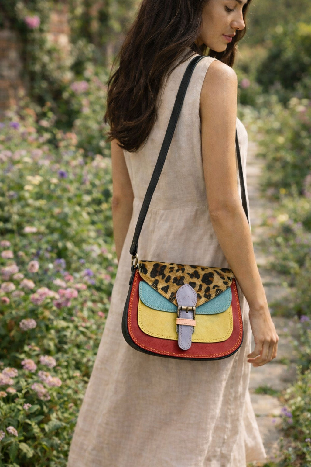 Handmade Leather Crossbody Bag featuring vibrant colors and leopard print flap, perfect for stylish outings.