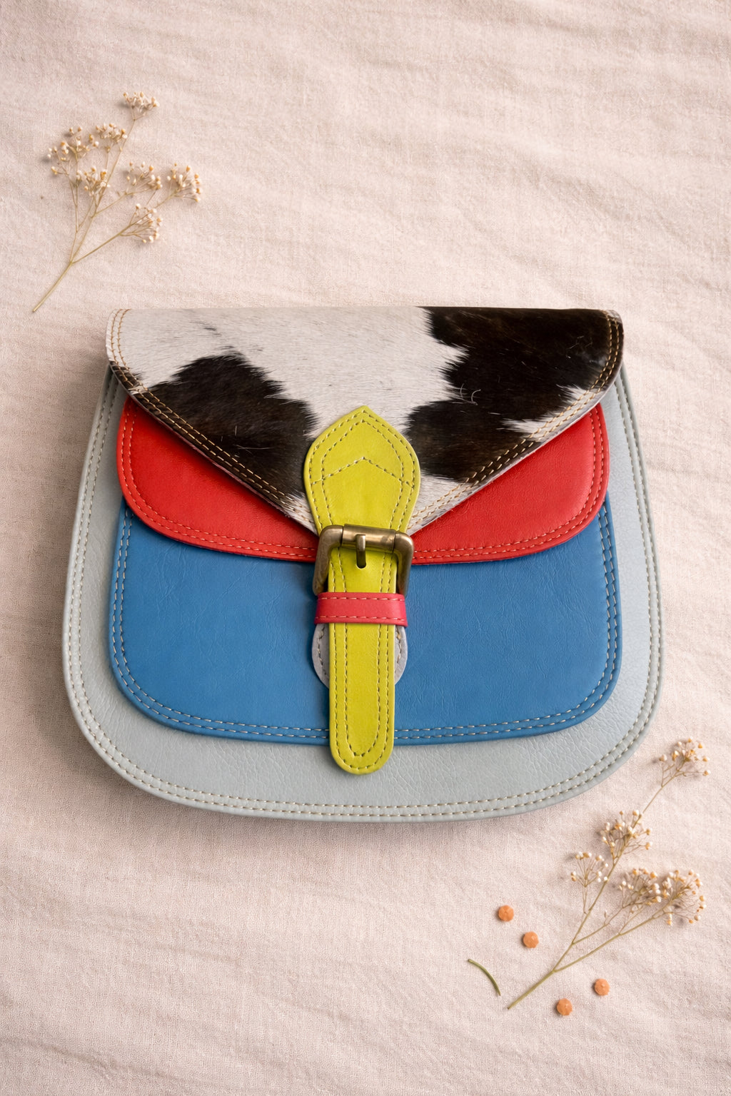 Handmade Leather Crossbody Bag featuring vibrant colors and unique textures, perfect for summer style.