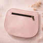 Handmade Leather Crossbody Bag - Romy - Petal resting on a sparkling surface with delicate flowers and ribbon.