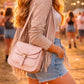 Handmade Leather Crossbody Bag - Romy - Petal resting on a sparkling surface with delicate flowers and ribbon.