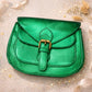 Handmade Leather Crossbody Bag in vibrant green worn at a festival, giving a stylish and fun vibe.