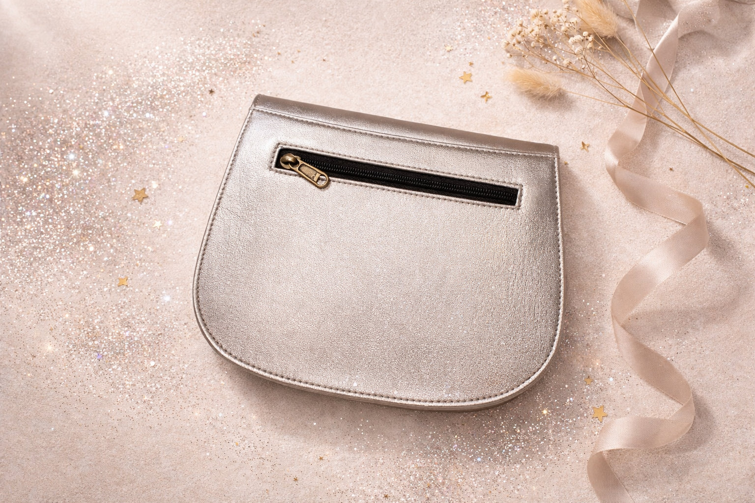 Handmade Leather Crossbody Bag - Romy - Aurum in metallic silver, surrounded by decorative elements and soft ribbons.