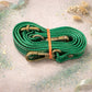 Handmade Leather Crossbody Bag in vibrant green worn at a festival, giving a stylish and fun vibe.