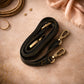 Handmade Leather Crossbody Bag - Romy featuring multiple colors and a stylish buckle strap on a textured background.