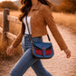 Handmade Leather Crossbody Bag - Romy - High Plains Painted Sky on a stylish background with a strap.