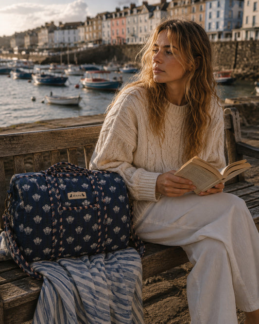 Handmade duffle bag featuring a quilted design and unique floral print, perfect for stylish adventures.